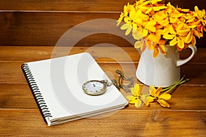 Antique pocket watch with yellow gardenia flower