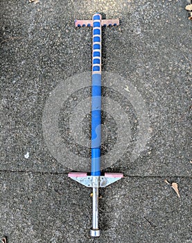 Antique pogo stick on concrete