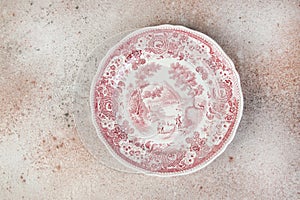 Antique porcelain dish on concrete background