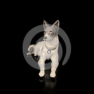 Antique porcelain figurine of a hunting dog. antique ceramic dog figurine