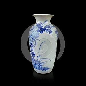 Antique porcelain vase in oriental style on a black isolated background.