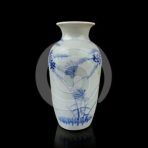 Antique porcelain vase in oriental style on a black isolated background.