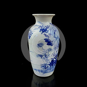 Antique porcelain vase in oriental style on a black isolated background.
