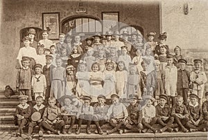 Antique portrait of school classmates. Children and teachers