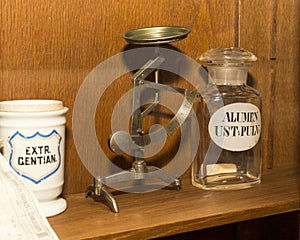 Accurate, medical, vintage, antique powder scales standing on a shelf