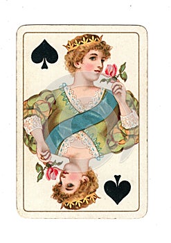 An antique queen of spades playing card.