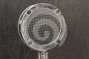 Antique Radio Microphone in chrome with black background. Stacked focus or Depth Compositing technique