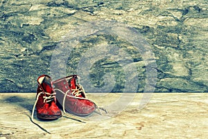 Antique red baby shoes. Vintage Instagram style