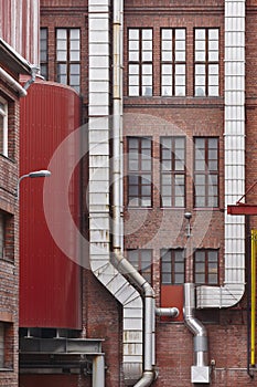 Antique red brick factory building facade in Tampere. Finland