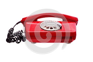 Antique red phone on a white