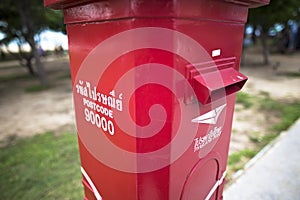 Antique red postal box with bokeh background found in Songkhla Thailand