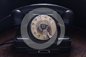 Antique retro phone on wooden board