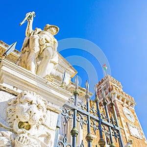 Antique sculptures in front of Arsenal harbor in Venice