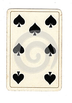 An antique seven of spades playing card.