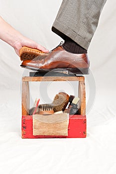 Antique shoe shine box and worker