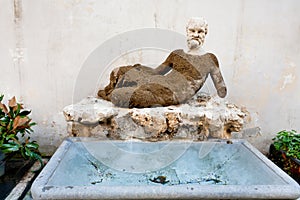 Antique Silenus statue on via del Babuino, Rome