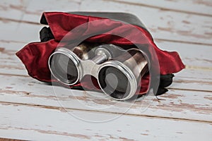 Antique Silver Binoculars with Leather Case and Red Fabric Cladding