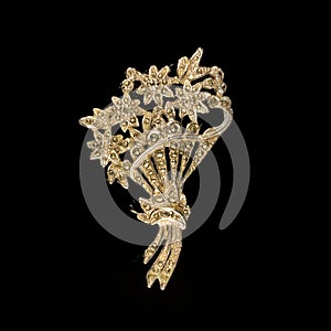 Antique silver brooch with precious stones and crystals in the shape of a flower.