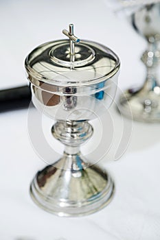 Antique silver chalice on white background