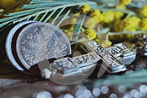 Antique silver coins with the double-headed eagle and an Orthodox cross. Vintage still life