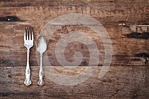 Antique Silverware over Rustic Wooden Background