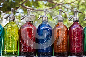 Antique Siphons bottles bright, colored Glass in Flea Market, Buenos Aires, Argentina