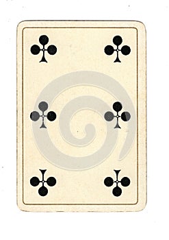 An antique six of clubs playing card.