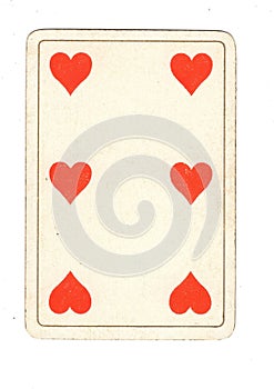 An antique six of hearts playing card.