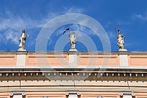 Antique statues on facade of Governor Palace in Piacenza