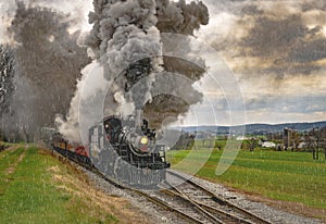 Antique Steam Passenger Train Traveling Thru Farmlands Puffing Lots of Smoke