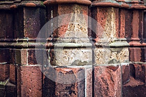 Antique stone column of old church wall as texture close-up. Photo Background