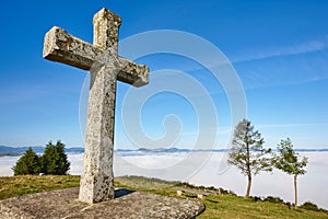 Antique stone cross sanctuary in Asturias, Spain. El Acebo photo