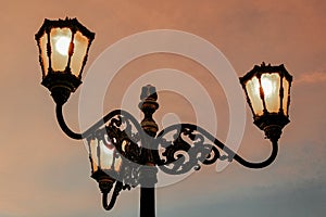 Antique street light over sunset in at yogyakartan city