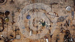 Antique Stuff hanging on the shabby Wall. Aged Household Collection. Retro Exibition. Israel, Zichron Jaakov. Photo