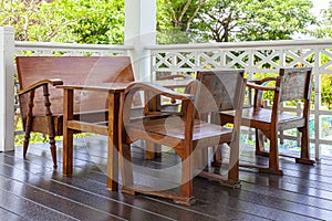 Antique style dark brown wooden living room set on a wooden