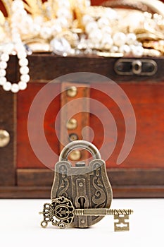 An Antique Style Lock and a Treasure Chest FIlled with Gold and DIamond Treasures