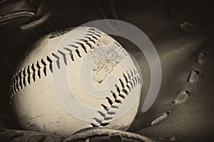 Antique style photograph of baseball and glove