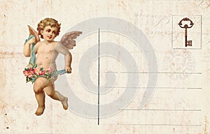 Antique style valentine`s postcard featuring cupid and heart