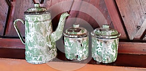 Antique teapot and teacups made of enamel tin called blirik teapots, blirik glasses and blirik teapots for tea, coffee or orange,