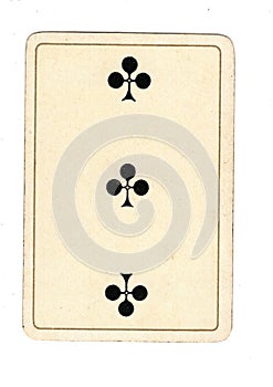 An antique three of clubs playing card.