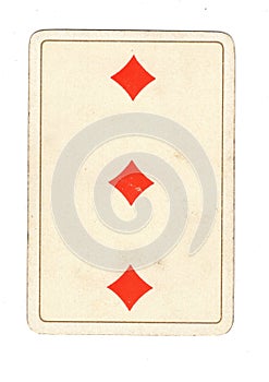 An antique three of diamonds playing card.