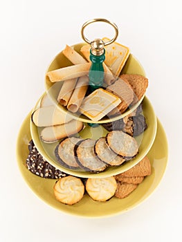 Antique Three Tier Server Tray with an Assortment of Cookies.