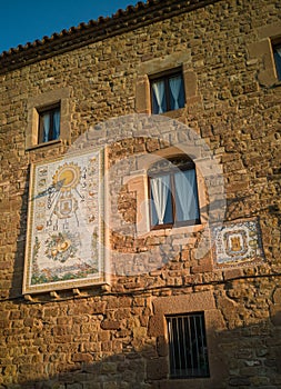 Antique tiles sundial at ancient stonewall Estany