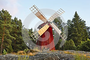 Antique traditional wooden windmill in Finland. Picturesque finn