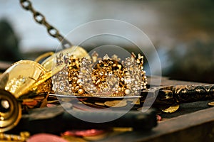 Antique treasure gold crown with coins for wealth , luxury and success concept