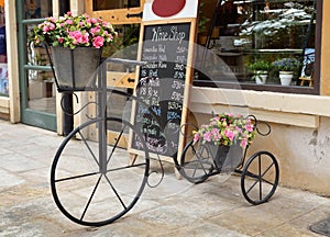 Antique tricycle and artificial flowers
