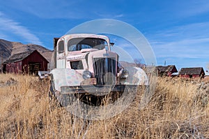 Antique truck abandoned in a farm field