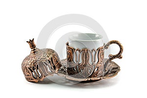Antique Turkish tea cup with white background.