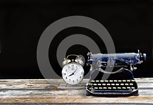 Antique Typerwriter and Alarm Clock.