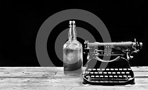 Antique Typerwriter and Whisky Bottle